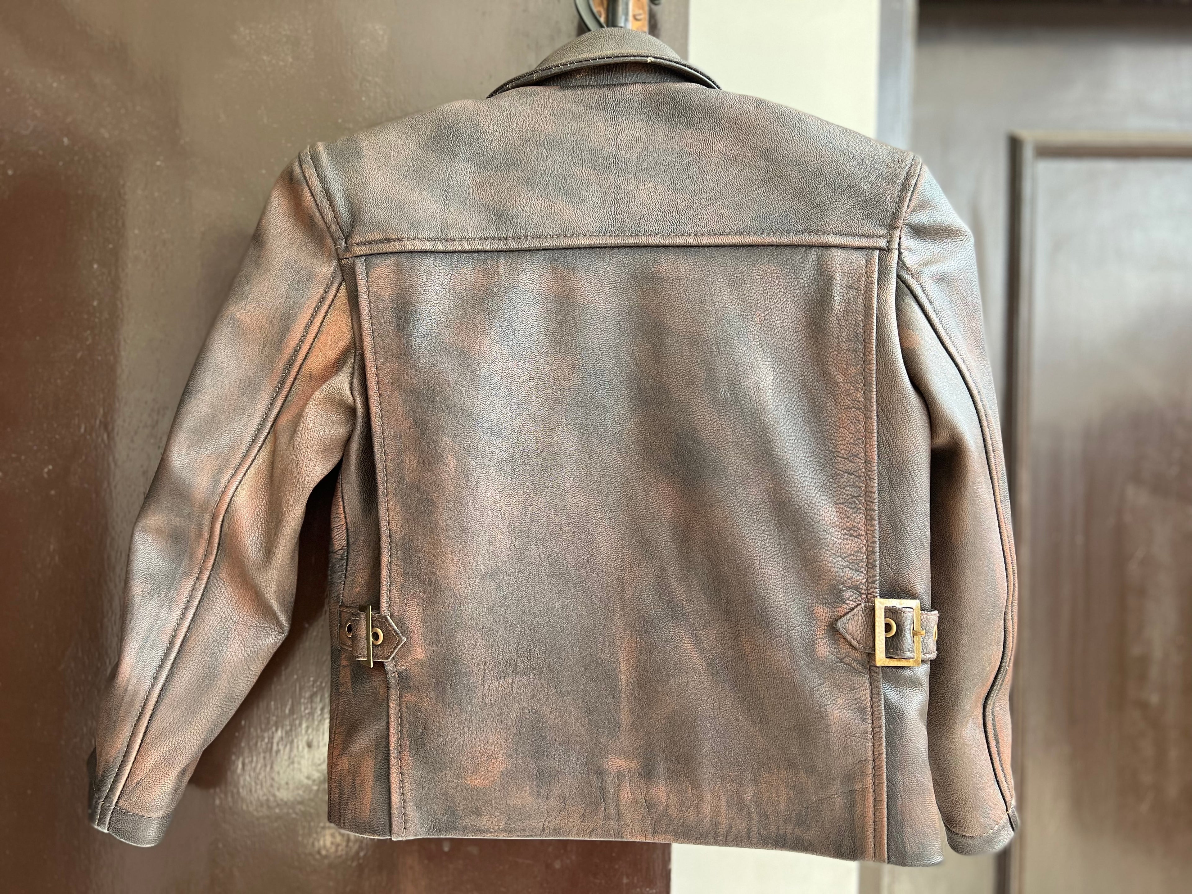 Back view of Kids Indiana Jones distressed real leather jacket with side buckles – toddler adventure outfit