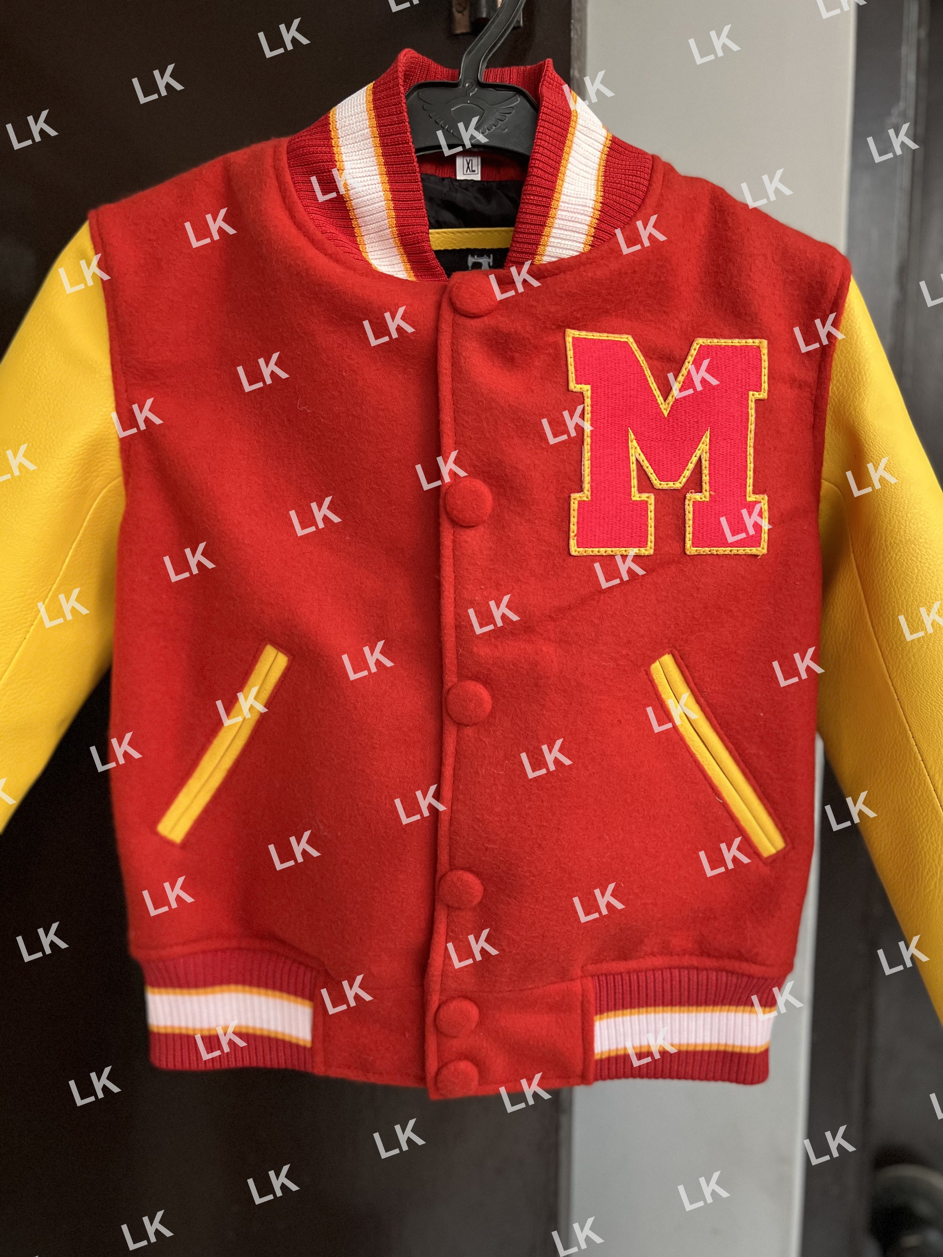 Front close-up of Kids MJ Thriller varsity bomber jacket with bold red wool body and yellow sleeves