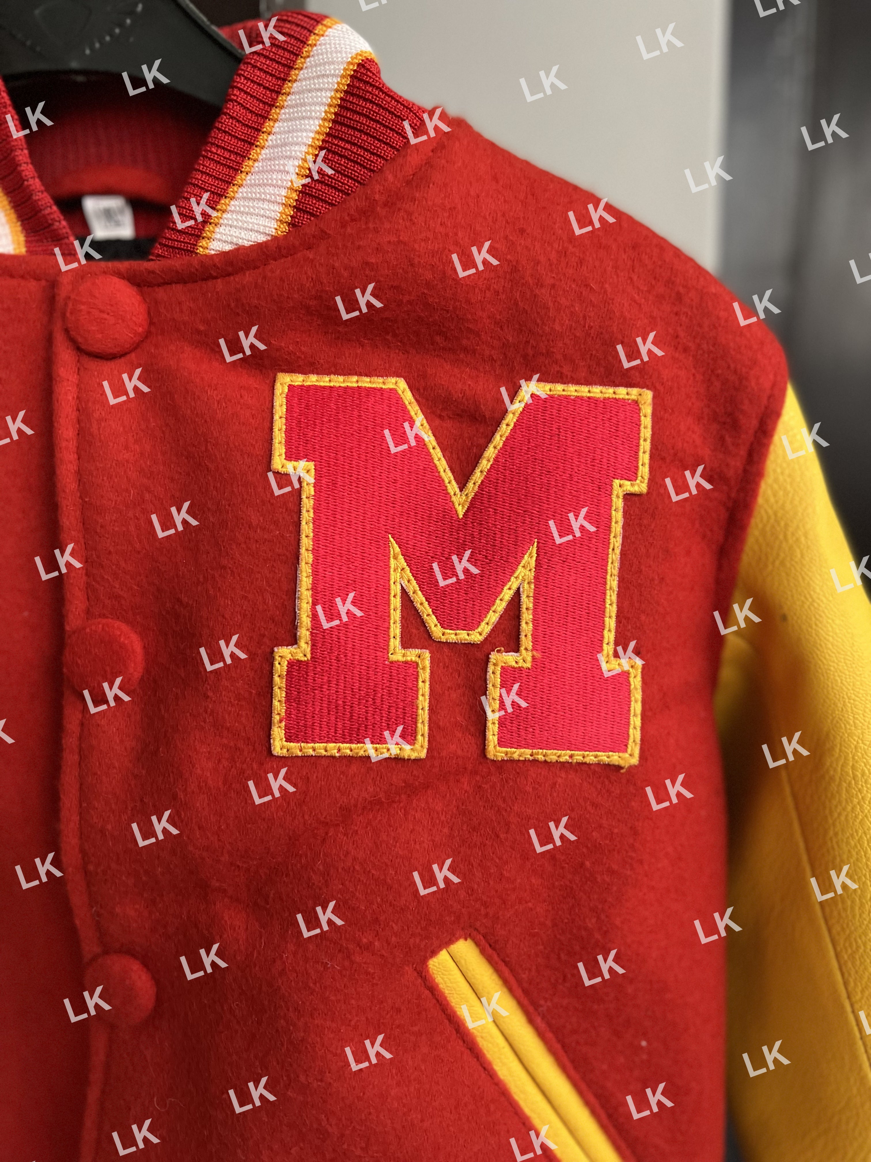 Detailed close-up of M letter patch on Kids Michael Jackson MJ Thriller toddler varsity wool jacket