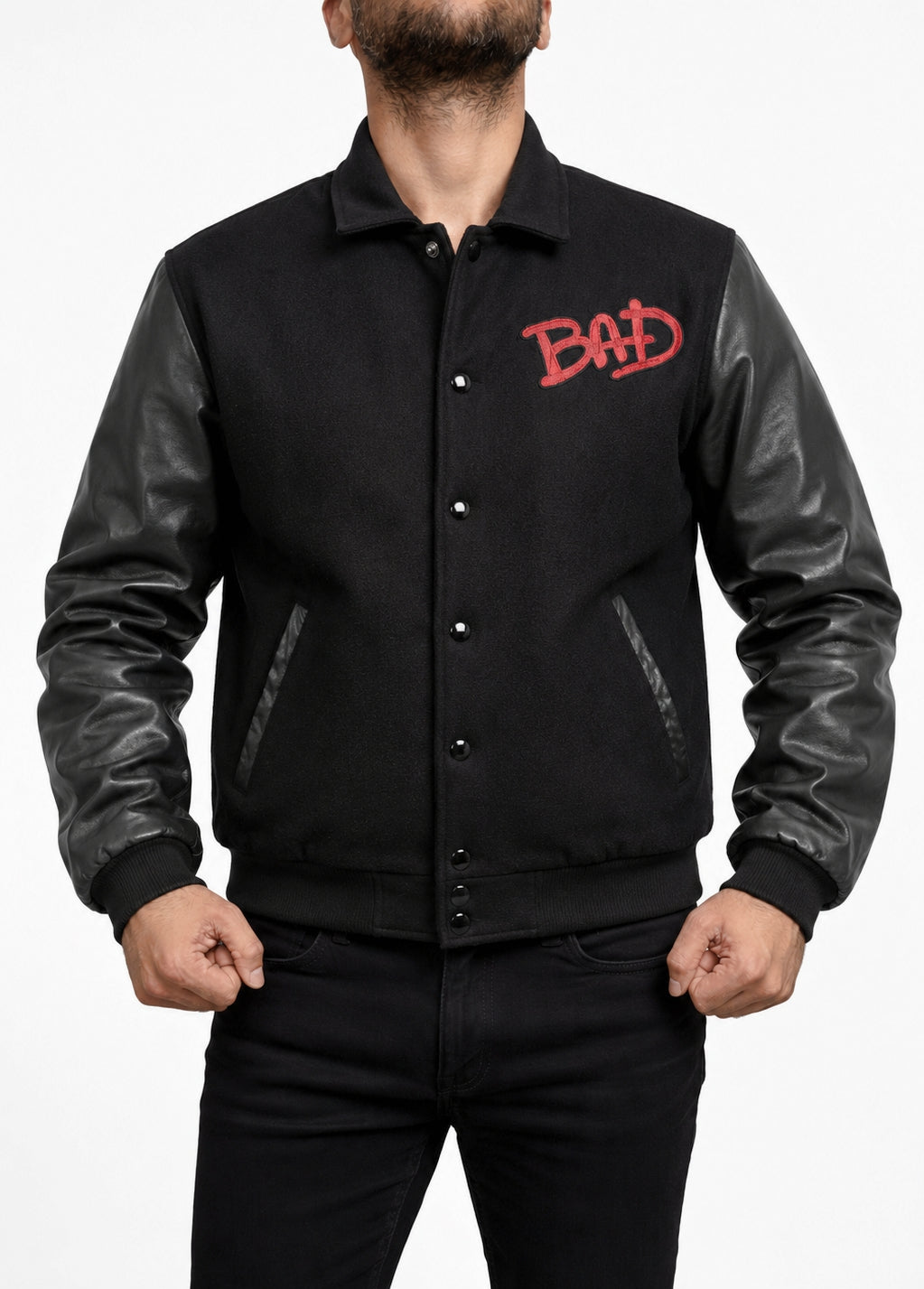 Michael Jackson MJ Bad World Tour Bomber Wool Jacket front view with red BAD chest logo, black wool body, leather sleeves, snap button closure, and waist pockets