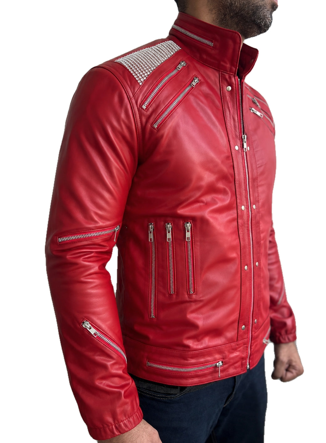 MJ Beat It classic red leather jacket side view with multiple silver zipper pockets and studded shoulders