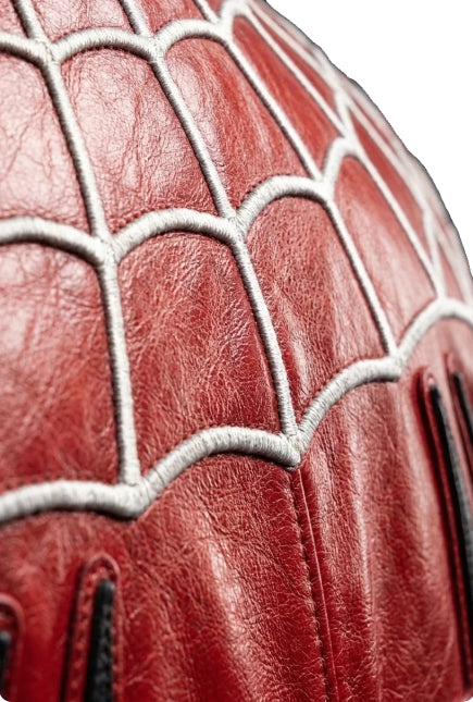 Close up of silver web embroidery on red leather Spiderman Peter Parker bomber jacket shoulder design