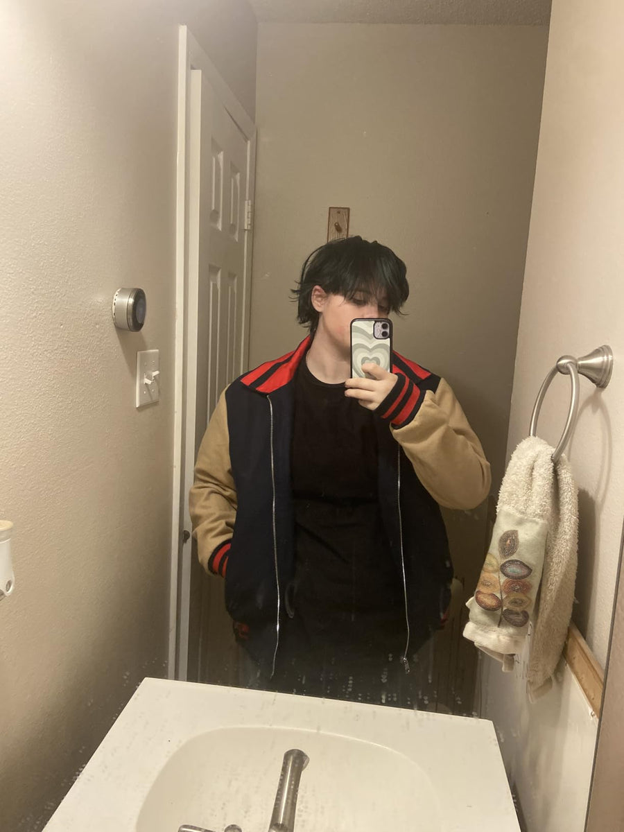 Stranger Things Will Byers bomber jacket inspired by Noah Schnapp featuring classic 80s varsity style worn by customer.